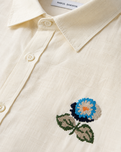 Floral embroidery detail on premium butter yellow linen shirt for men