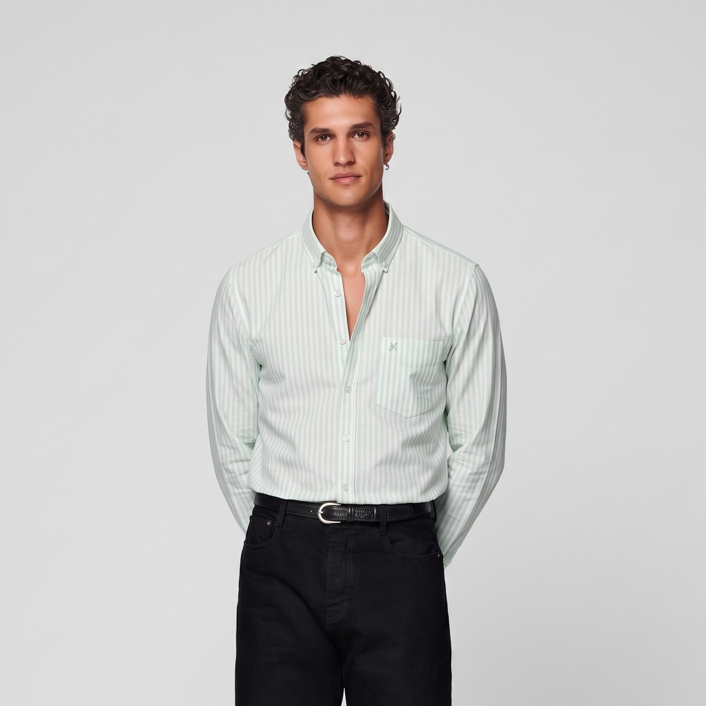 Male model wearing mint green striped Oxford shirt for men