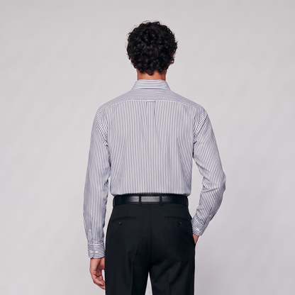 Back view of male model wearing premium navy blue striped Oxford shirt