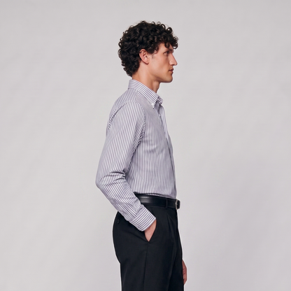 Side profile of male model wearing navy blue striped Oxford shirt