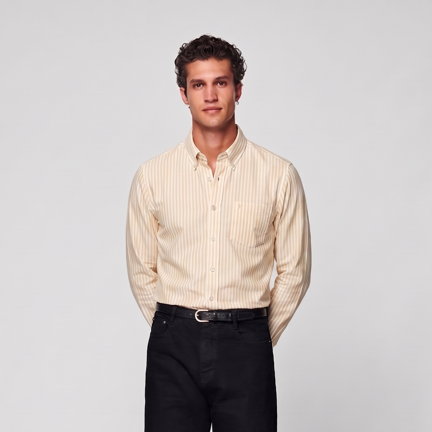 Male model wearing pastel yellow striped Oxford shirt for men