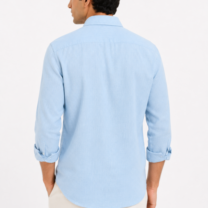 Back view of male model wearing premium sky blue embroidered linen shirt