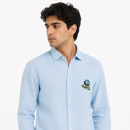 Male model wearing sky blue embroidered linen shirt for men by Nakul Sakhiya