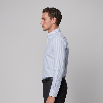 Side profile of male model wearing sky blue striped Oxford shirt