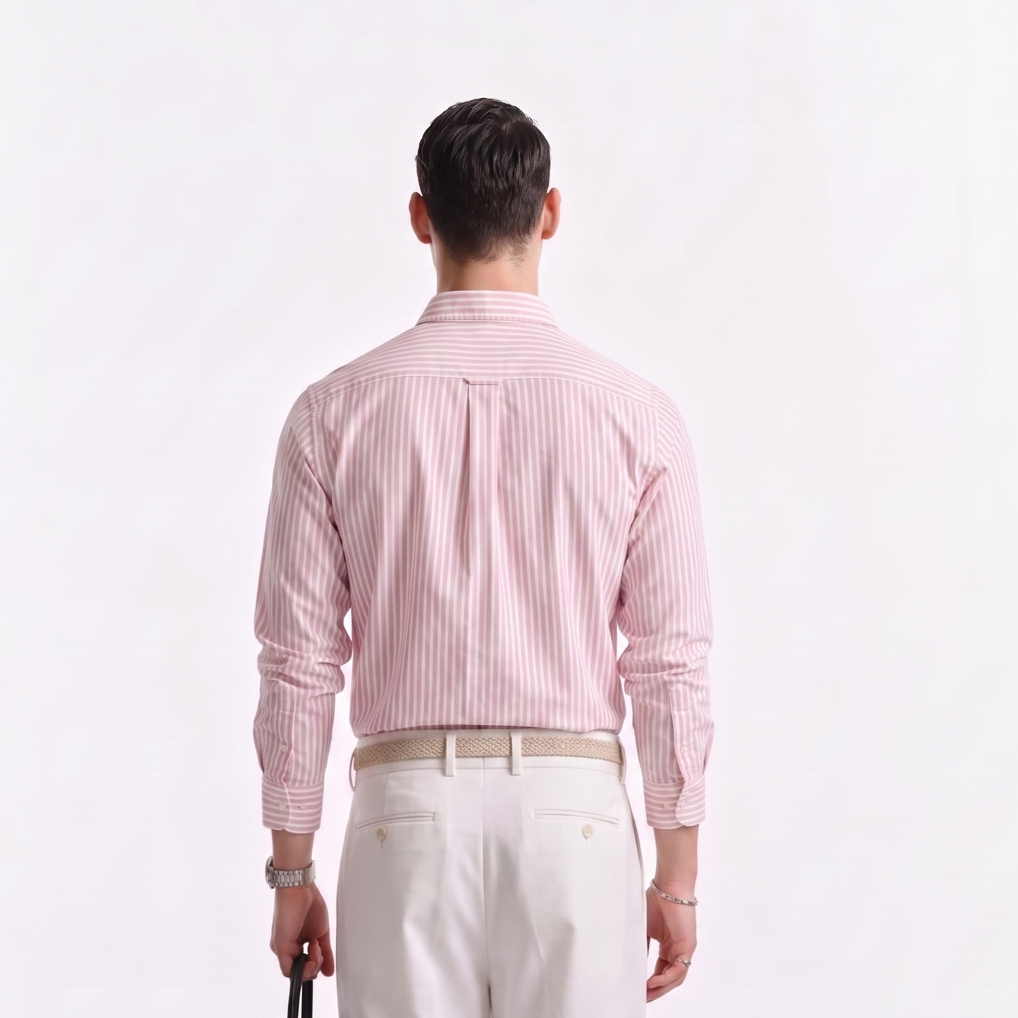 Back view of male model wearing premium soft pink striped Oxford shirt