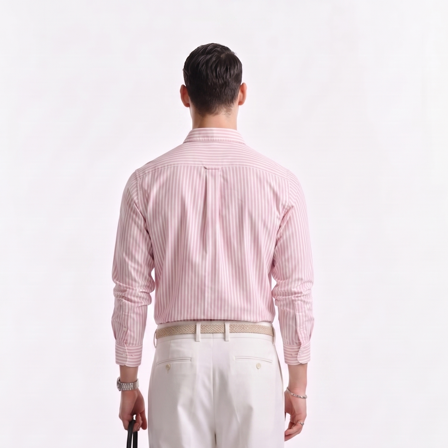 Back view of male model wearing premium soft pink striped Oxford shirt