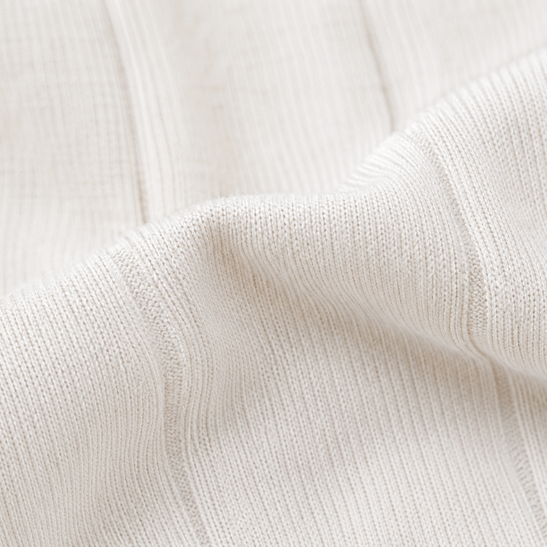 Close Up Fabric Detail of Premium White and Navy Polo T Shirt
